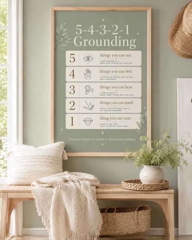 The 5-4-3-2-1 Grounding poster in a light oak frame, hanging above a bench in a sunlit hallway.